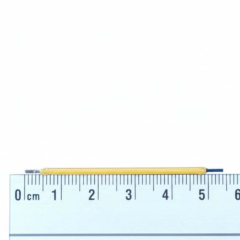 White led with a ruler for scale on a white background