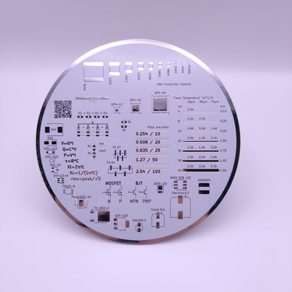 Circular printed circuit coaster board (PCB) with text and symbols on a white background